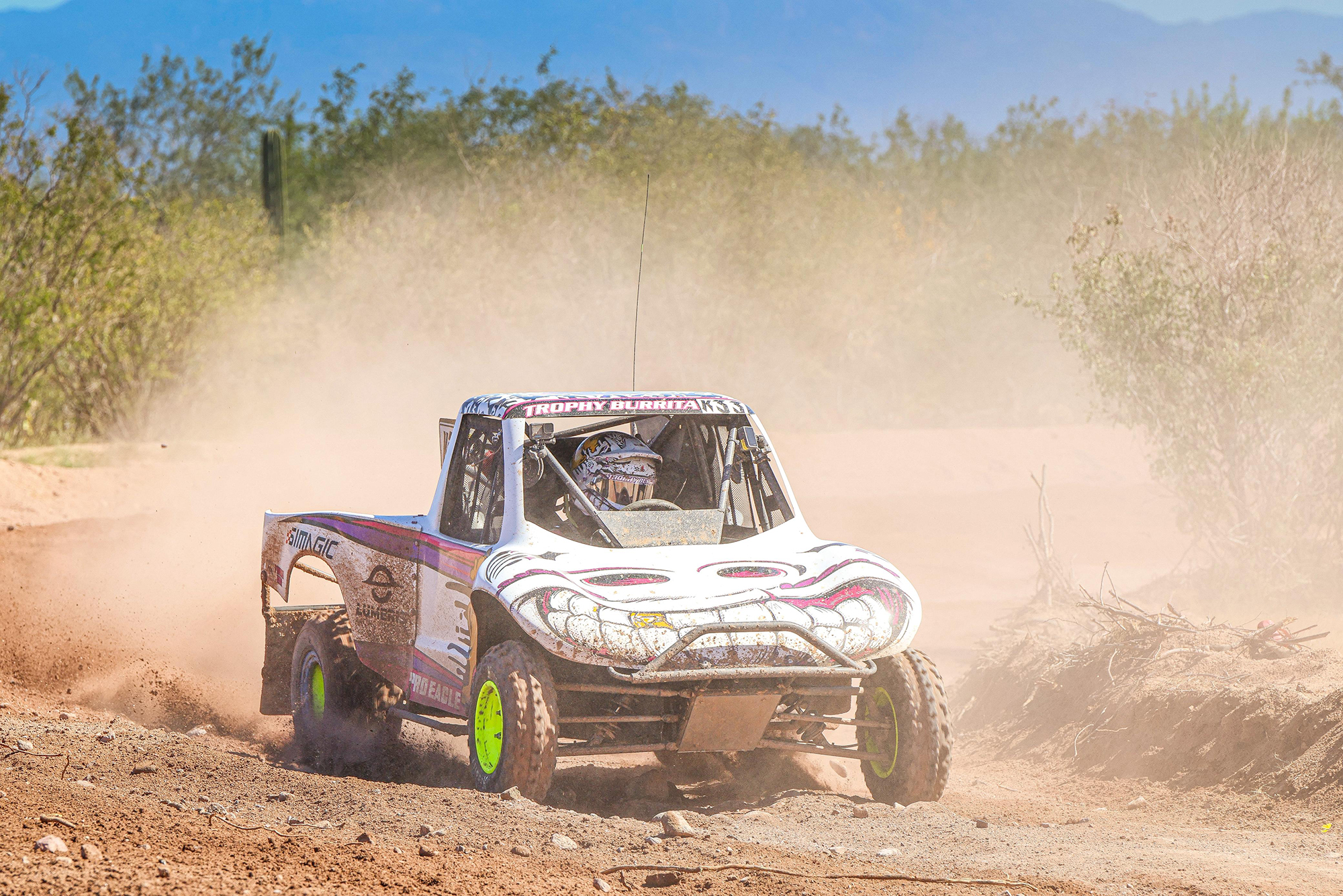 Baja off-road racing truck and kart in the desert